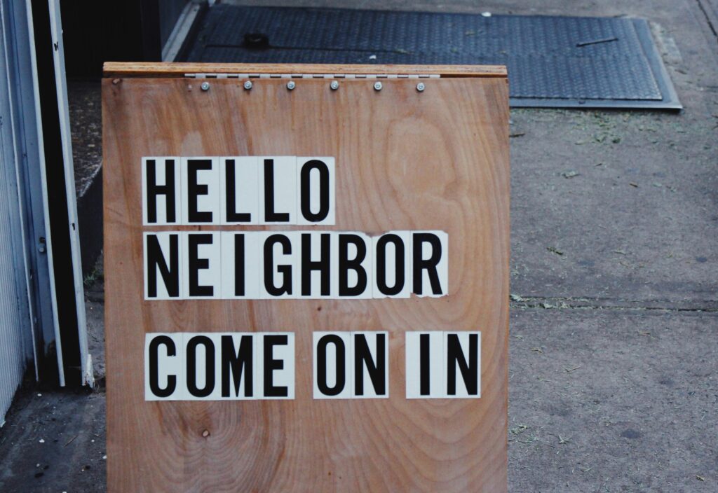 sign saying hello neighbor come on in