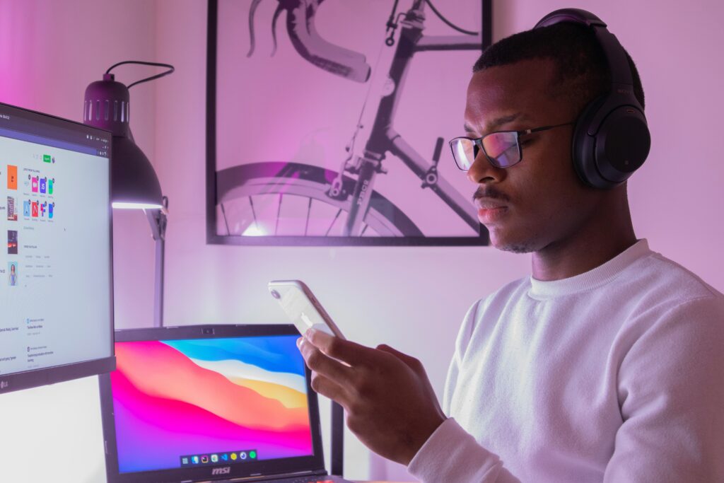 Man at desk distracted by phone