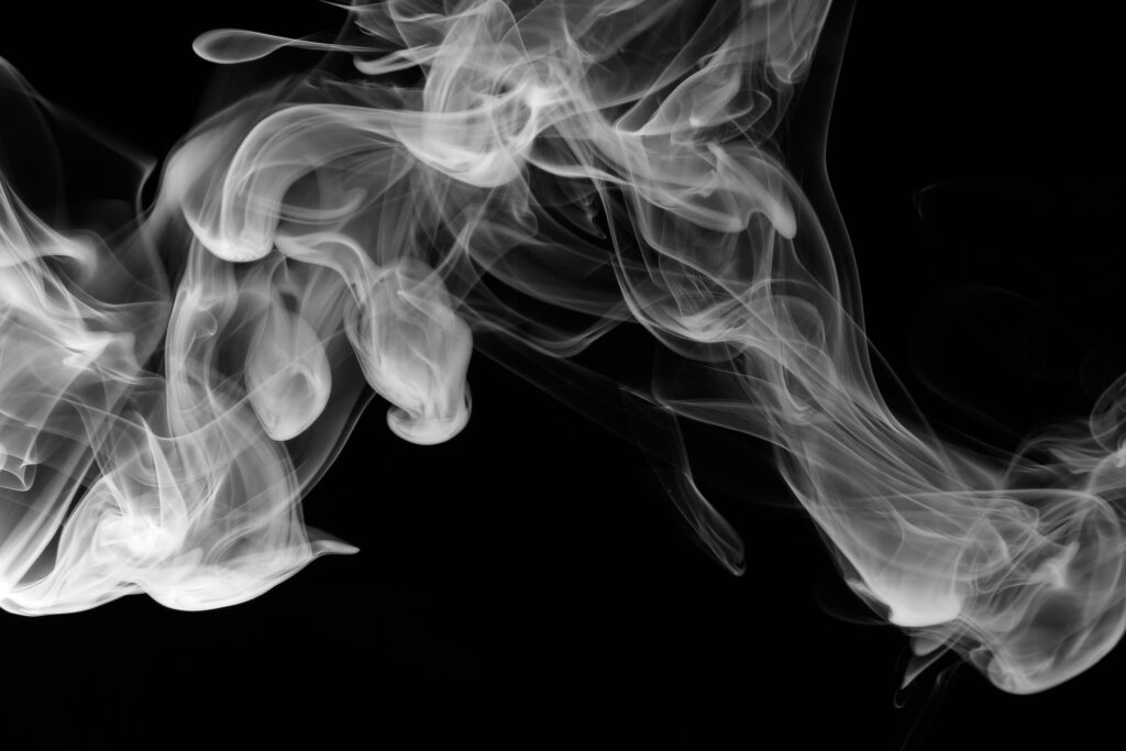 white smoke on black background