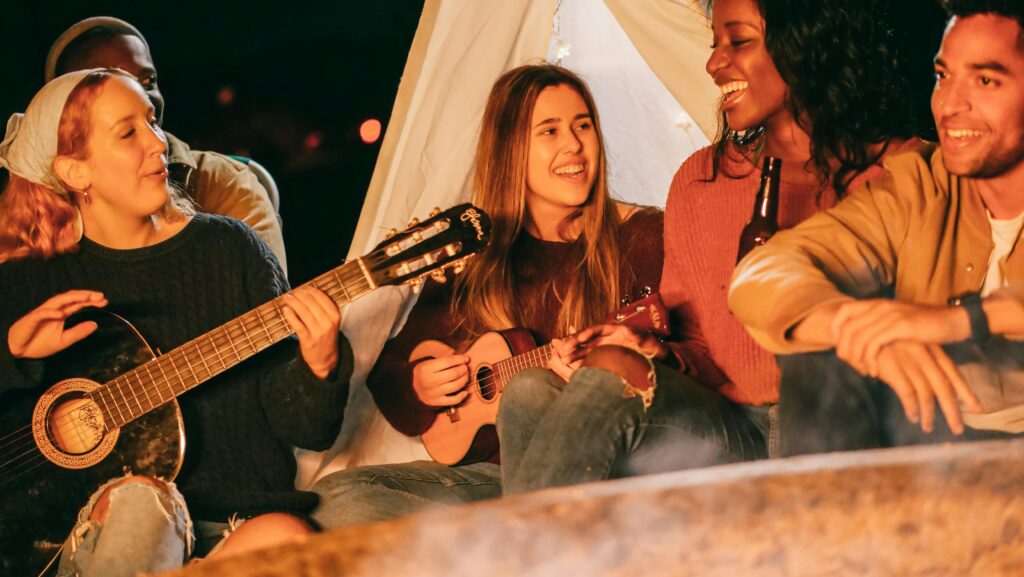 group-of-friends-singing-while-having-a-bonfire