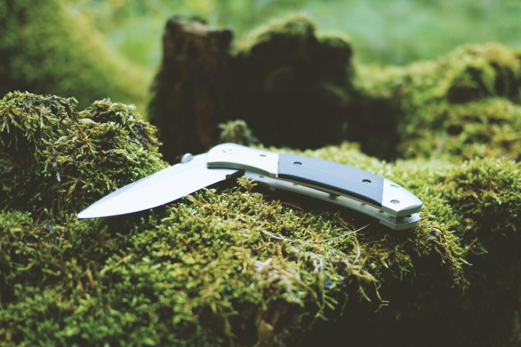pocket knife on moss