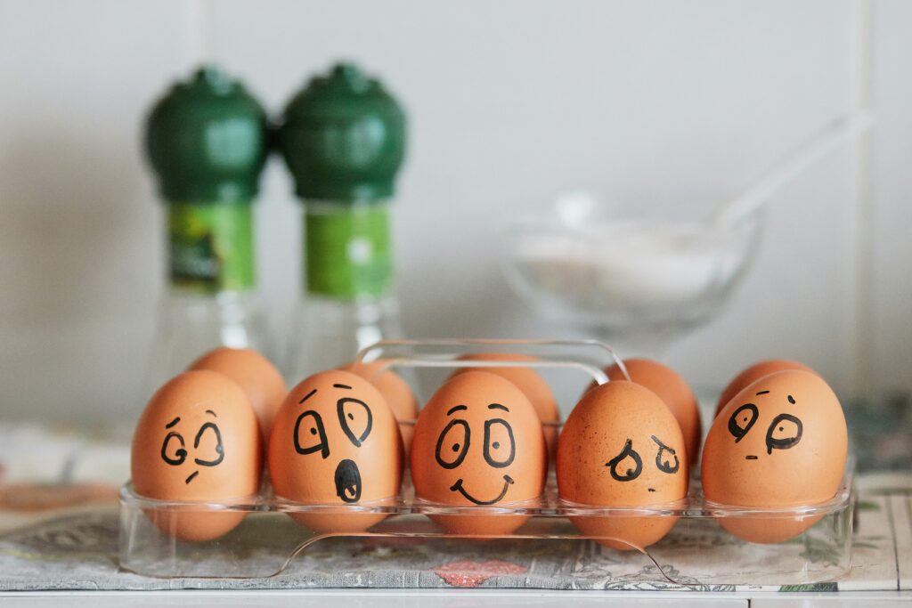 eggs with different emotional expressions drawn on them