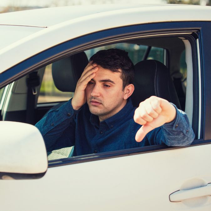 unsatisfied man with his car