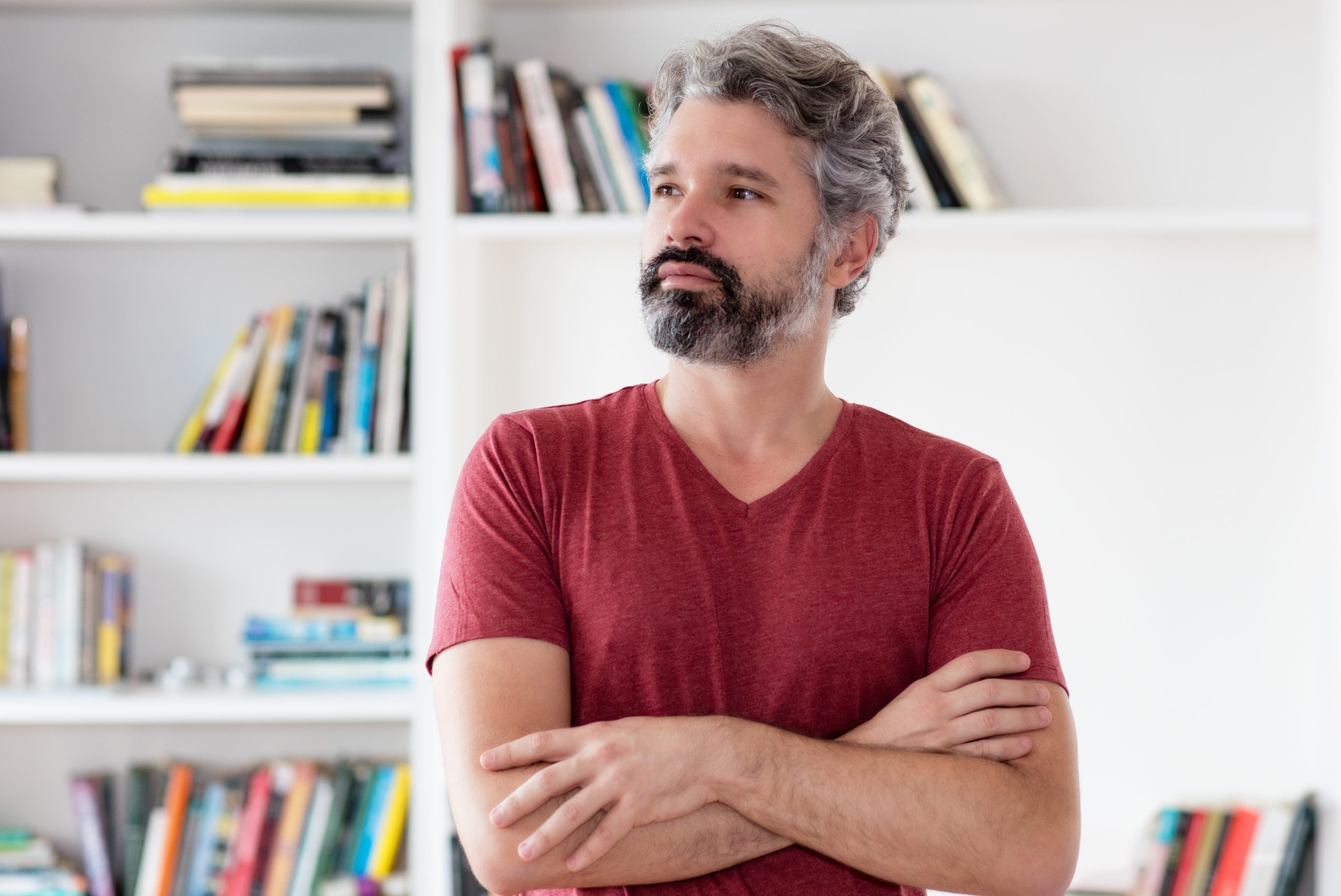 Smart german middle aged man with grey hair indoors at home