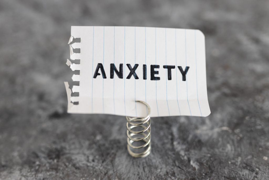 psychology and mental health concept, memo with text Anxiety inside of white box metaphor of mind struggles