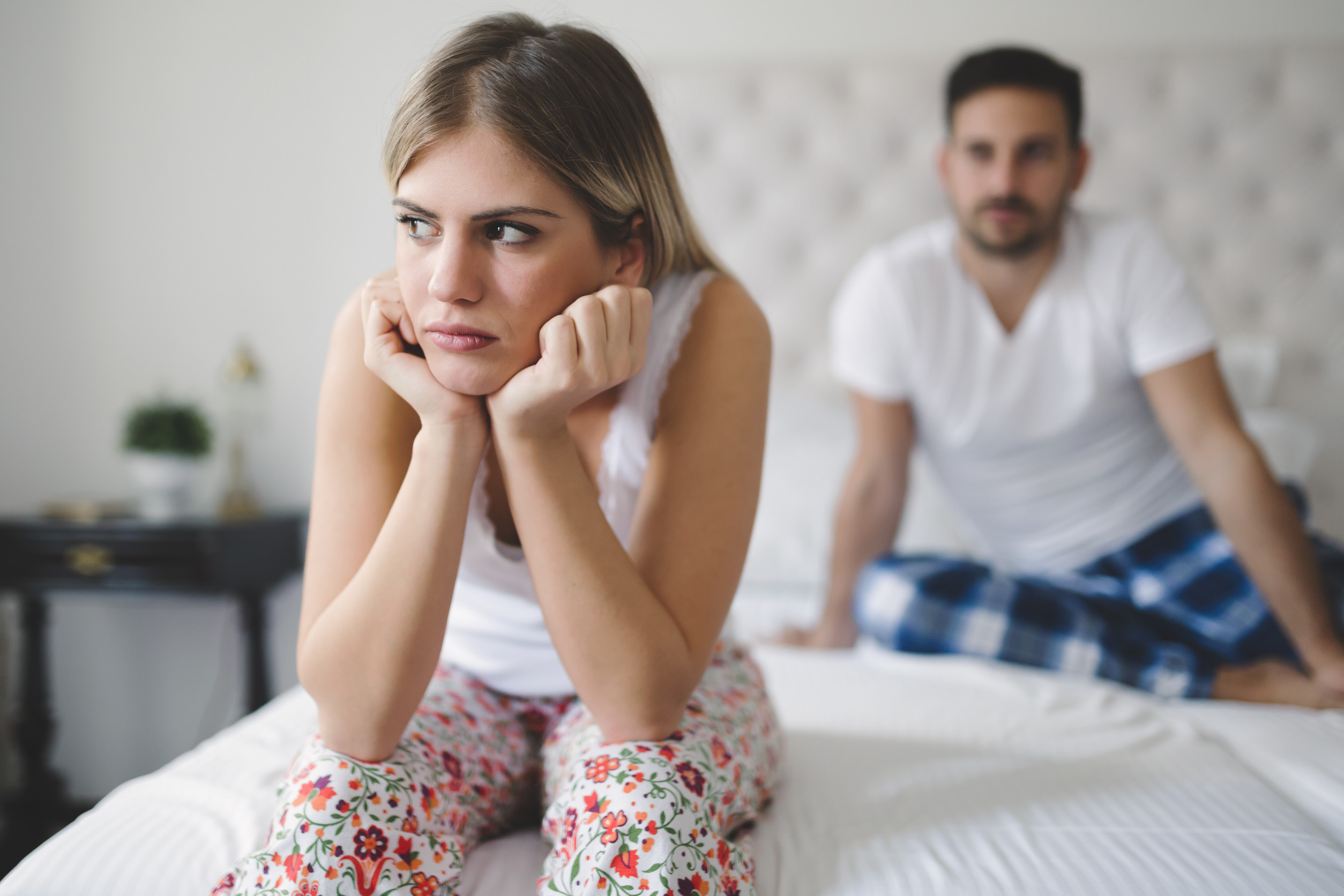 Relationship crisis in bed with feeling of guilt